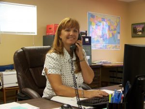 A member of the Tom Culbreth Bail Bonds team helping a caller from the Cocoa office